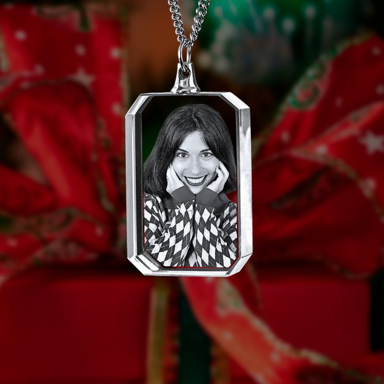 A photo of a happy woman engraved in a 3D Necklace Rectangle