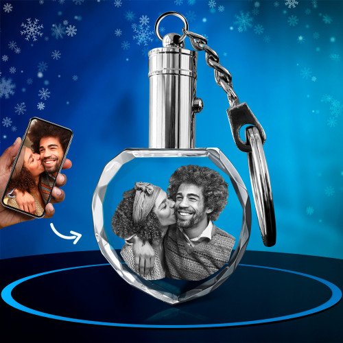 A Keychain Heart engraved with a photo of a cheerful man and his wife. Xmas.