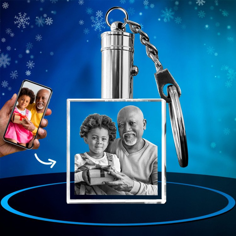 A photo of a happy father with son engraved in 2D inside a square crystal keychain with LEDs. Xmas.